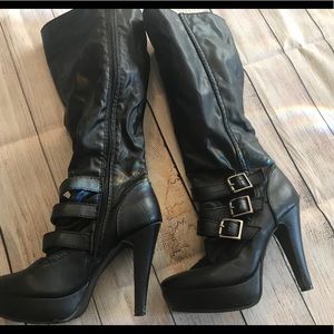 Black high heeled boots. Size 7.5.
